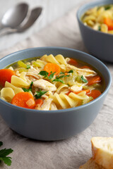 Homemade Chicken Noodle Soup in a Bowl, low angle view. Close-up.