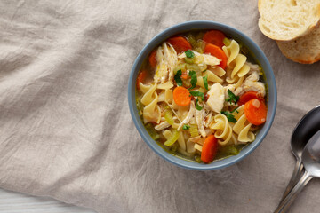Homemade Chicken Noodle Soup in a Bowl, top view. Flat lay, overhead, from above.