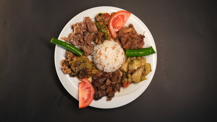 several meat dishes in one plate
