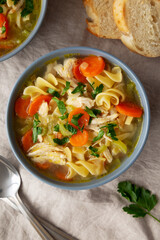 Homemade Chicken Noodle Soup in a Bowl, top view. Flat lay, overhead, from above.