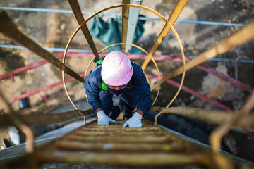 Male climb the stairway storage visual inspection tank