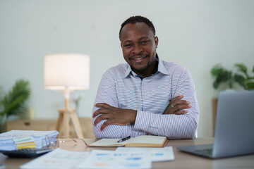 middle aged man American African business man holding computer laptop with hands up in winner is gesture, Happy to be successful celebrating achievement success