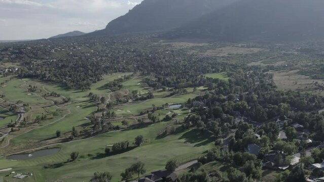Colorado Country Club Golf Course, with Cheyenne Mountain in the background in Colorado Springs, Colorado. Aerial 4K drone video in the Rocky Mountains. 