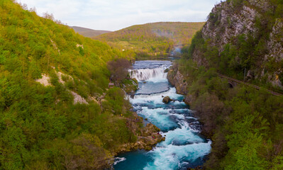 Fototapeta na wymiar Strbacki buk (strbaki buk) waterfall is a 25 m high waterfall on the Una River. It is greatest waterfall in Bosnia and Herzegovina