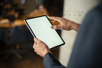 Close up of man using digital tablet.