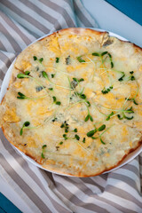 Vegetarian pizza. Mushrooms, microgreens. Four cheese thin dough. Homemade pizza on a plate top view. Healthly food background.