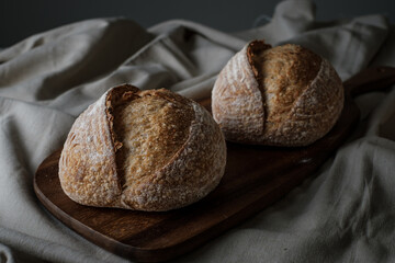 Artisan Batard Sourdough healthy Bread. Open crumb high hydration Sourdough french country bread set on dark background. - 586946415