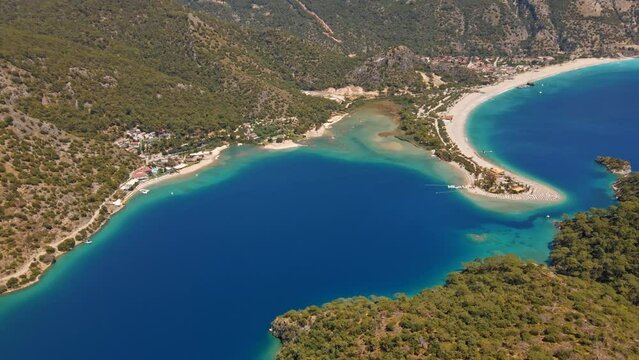 Oludeniz is a resort village on the southwest coast of Turkey. known for the blue lagoon of Oludeniz Tabiat Parki and the wide, white Belcekiz Beach.