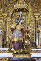 Obraz premium Saint Margarethe statue and Chapel, Our Lady of the Assumption Church, Alte, Loule, Algarve, Portugal
