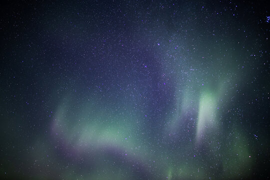 Aurora borealis over deep space stars