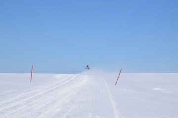 A snowmobile trail in a field, Québec, Canada