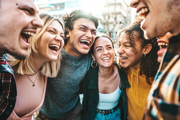 Multiracial happy friends laughing walking outside - Cheerful young people having fun hanging out on summer day - University students smiling standing together in college campus - Backlight filter