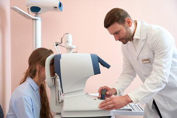 Charming lady is getting qualified checking eyesight in the clinic