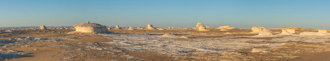 Barren desert landscape in hot climate with rock formation
