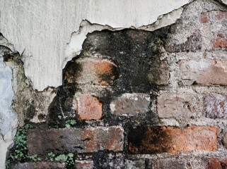 Texture of a brick wall with signs of fire
