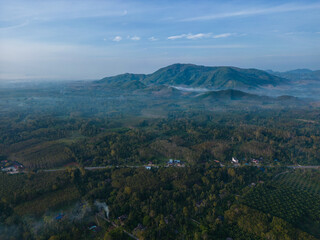 Fototapeta premium Aerial view morning sunrise with fog river mountain