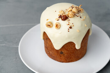Traditional Easter cake with nuts on gray background