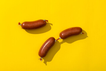 Sausages on the yellow background.