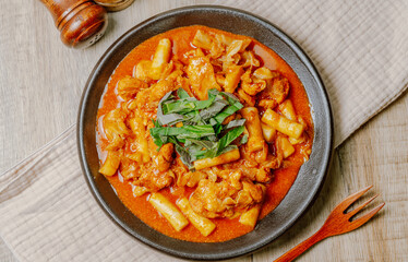 Dakgalbi, korean style Spicy Stir-fried Chicken with rice cake, Chicken pieces marinated in a gochujang, and stir-fried in a flat grill pan with cabbage, sweet potato, carrots, and tteok (rice cakes).