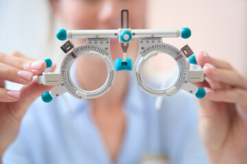 Detail photo of ophthalmology trial frame in front of the doctor