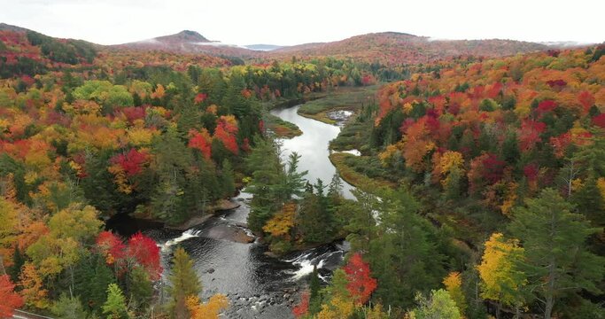 Aerial view of the Bog River rapids near Tupper Lake in Adirondack Park in Upstate New York during fall.