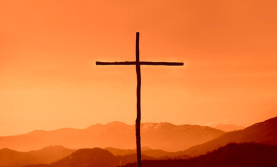 cross crucifixion of the crucifixion of jesus christ on a mountain. blue sky background....