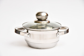 Metal chrome saucepan with a glass lid on a white background.