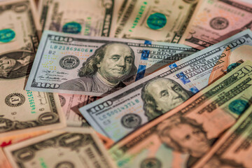 Scattered dollars obverse in view. The concept of inflation and banking problems in America
