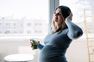Mental health and wellbeing during pregnancy. Pregnant woman preparing to yoga and meditation exercise at home.
