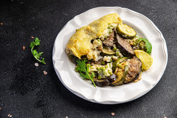 casserole vegetable lasagne eggplant, zucchini, green peas, cheese, bechamel sauce vegetables meal food snack on the table copy space food background rustic top view