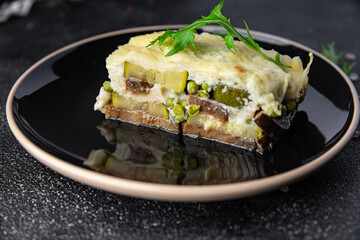 casserole vegetable lasagne eggplant, zucchini, green peas, cheese, bechamel sauce vegetables meal food snack on the table copy space food background rustic top view