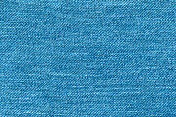 Obraz premium Top view of denim jeans texture background. Canvas blue denim cloth fabric textile use as background.