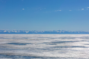 Fototapeta premium Frozen Lake and Snowy Mountains Winter Landscape