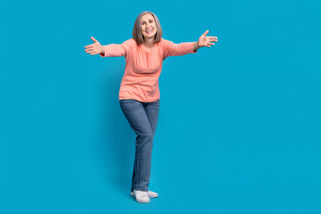 Full body length photo of friendly old woman peaceful want hugs meeting with her kids satisfied soulmates isolated on blue color background