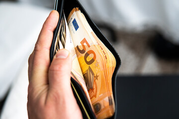 Euro money in an open wallet