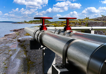 Gas pipeline. Pipes on coastal cliff. Steel pipeline on ocean. Pipes for transportation of gas and oil. Export of energy resources. Metal pipes with red valves. Gas pipeline on rocks