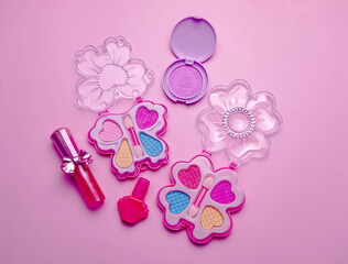 Children's set of decorative cosmetics for a little girl. Flat lay.