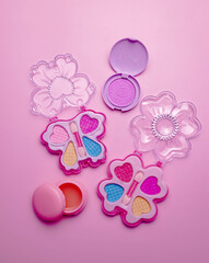 Children's set of decorative cosmetics for a little girl. Flat lay.