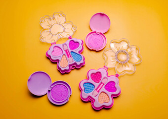 Children's set of decorative cosmetics for a little girl. Flat lay.