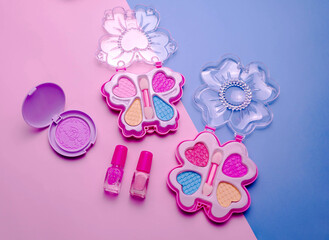 Children's set of decorative cosmetics for a little girl. Flat lay.