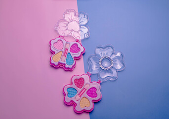 Children's set of decorative cosmetics for a little girl. Flat lay.
