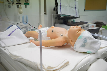 New born mannequin during a pediatric resuscitation simulation workshop.