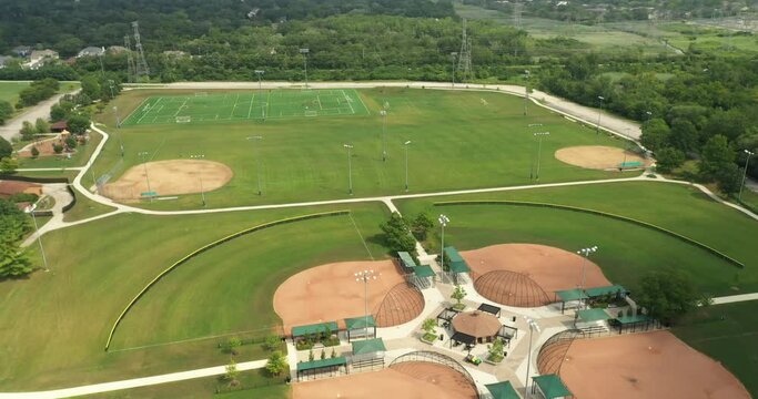 Aerial view of a lighted multi-use playfield complex with soccer, baseball and softball fields.