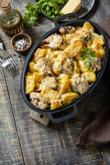 Fish casserole mackerel, potato with cheese and creamy sauce. Greek food. Copy space.