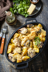 Fish casserole mackerel, potato with cheese and creamy sauce. Greek food.