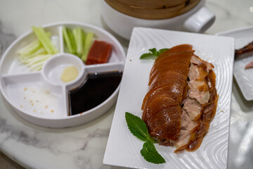 A crisp, dry and fragrant Peking duck, sliced skin duck