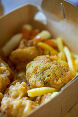 A delicious and crunchy Korean fried chicken served with fried rice cakes