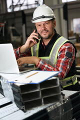 Portrait of employee talking with client on phone