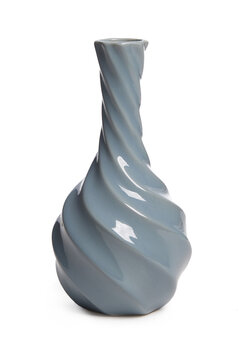 Close-up shot of a gray faceted ceramic vase. A small empty vase with a long narrow neck is isolated on a white background. Front view.