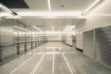 Corridor with marble floor at a modern city subway station